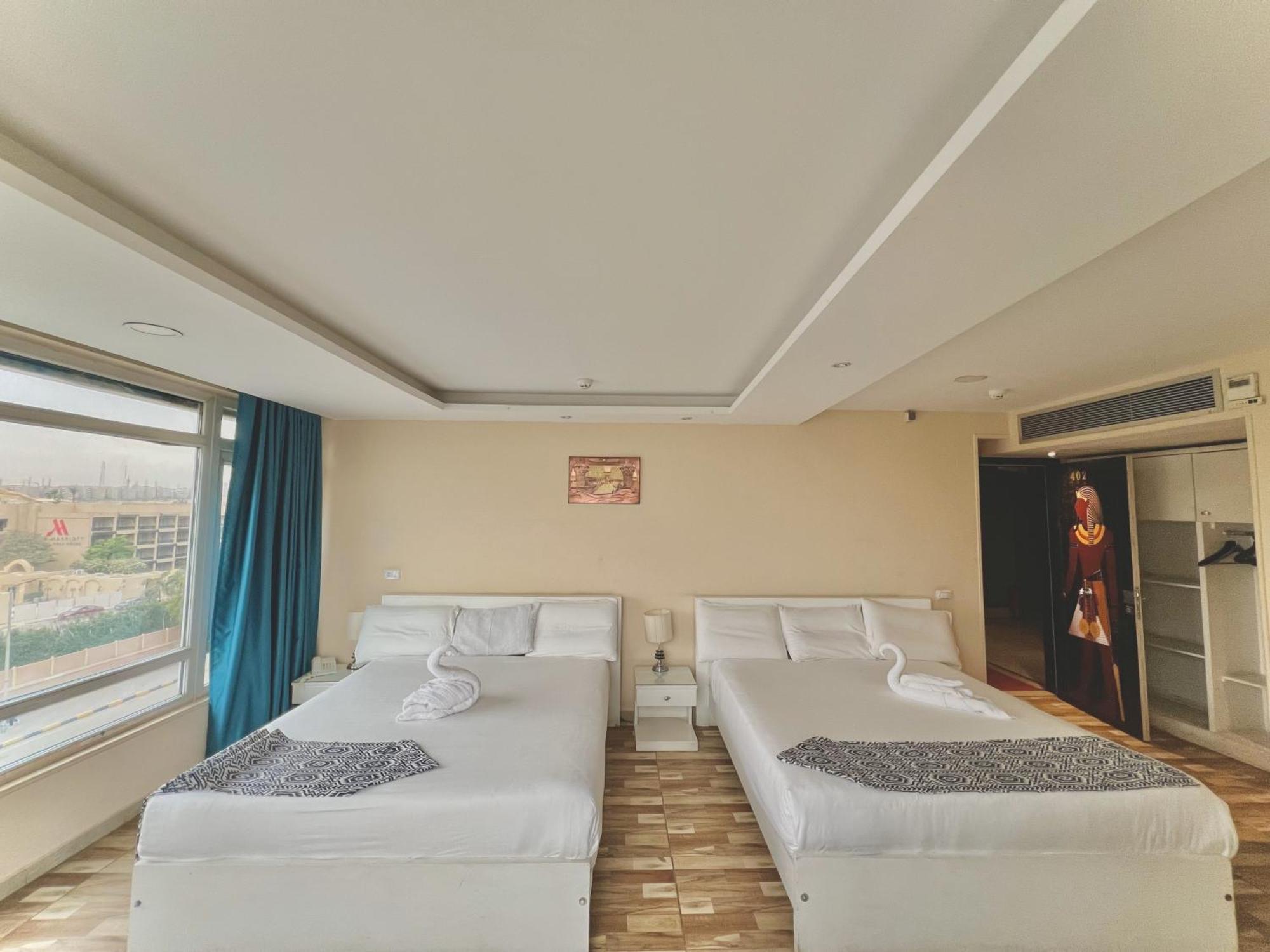Turquoise Pyramids & Grand Egyptian Museum View Hotel Kafrat al Jabal Luaran gambar